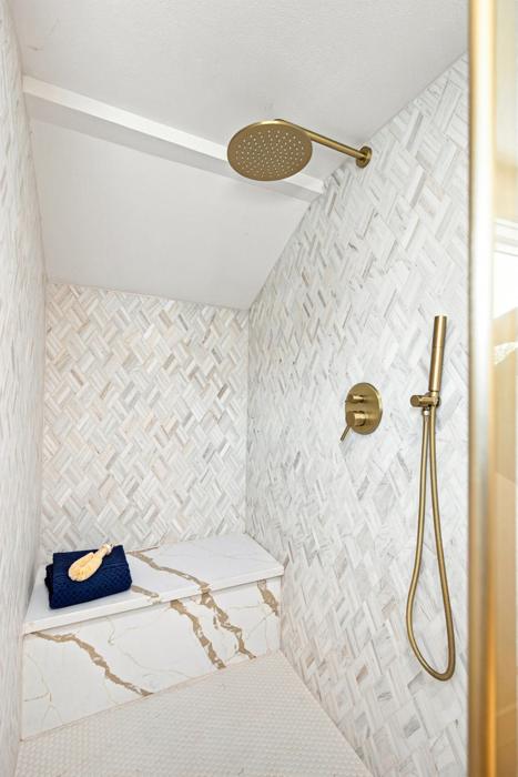 Tiled shower with bench. Marble mosaic, quartz bench, rain head and handheld